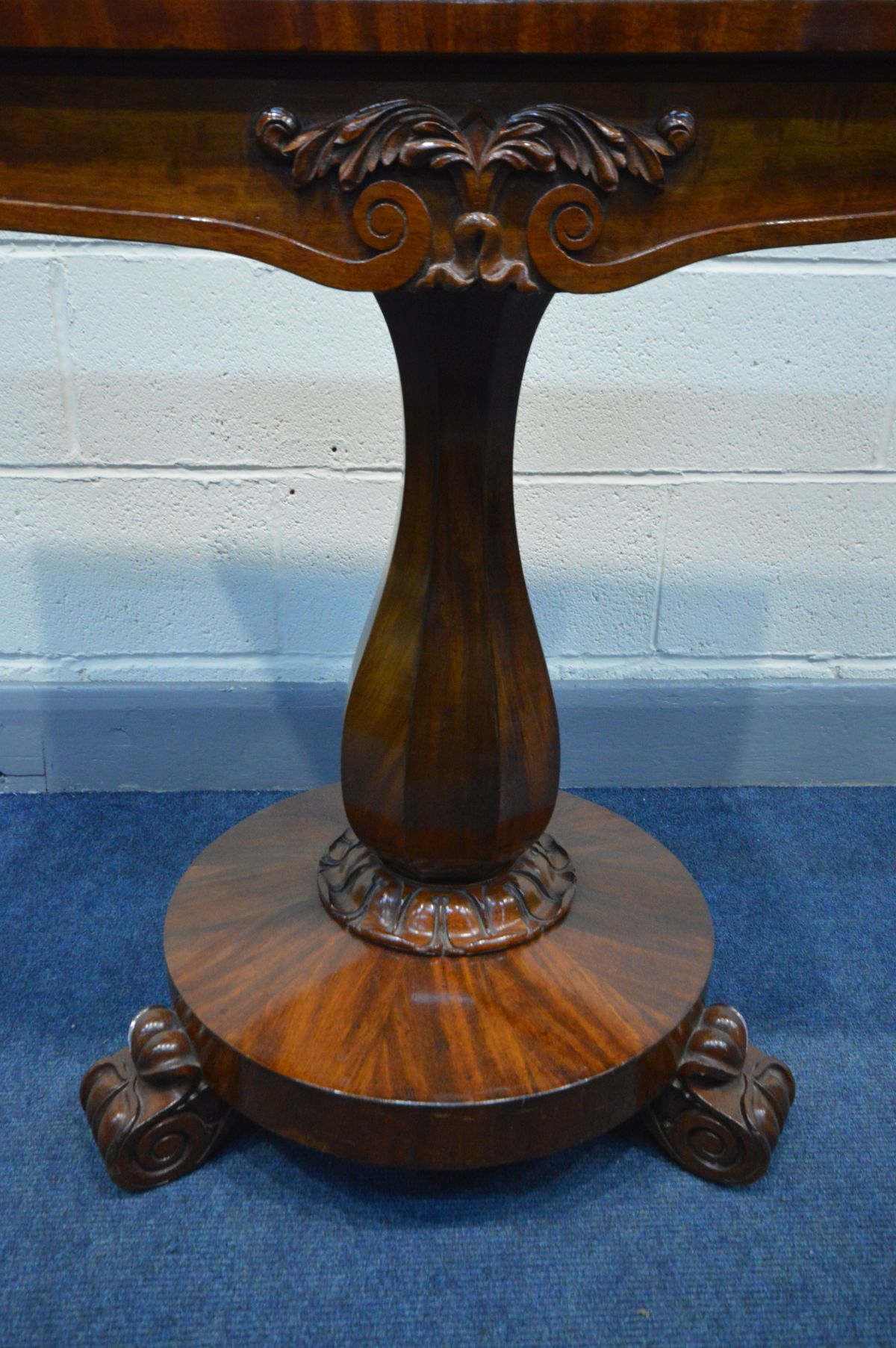 A VICTORIAN MAHOGANY TEA TABLE, canted front corners, fold over top, on a shaped octagonal - Image 4 of 6