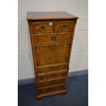 A TALL SLIM YEW WOOD SECRETAIRE CHEST, comprising of two short and four long graduated drawers,