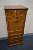 A TALL SLIM YEW WOOD SECRETAIRE CHEST, comprising of two short and four long graduated drawers,