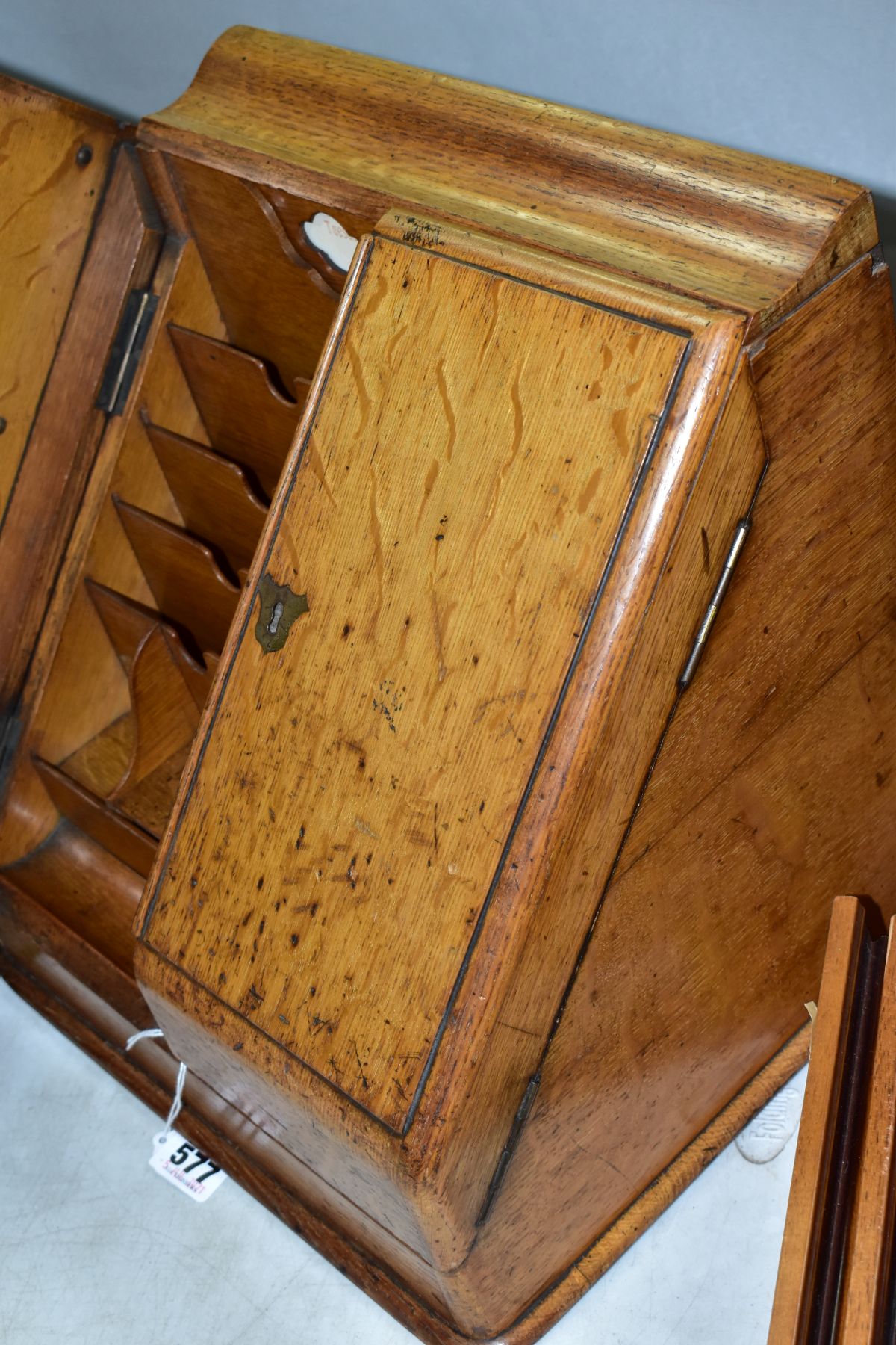 AN EDWARDIAN OAK STATIONERY BOX, hinged top above sloped double doors opening to reveal a fitted - Image 5 of 7