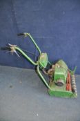 A VINTAGE PETROL CYLINDER MOWER with 17in cut (engine pulls freely but hasn't been started) in