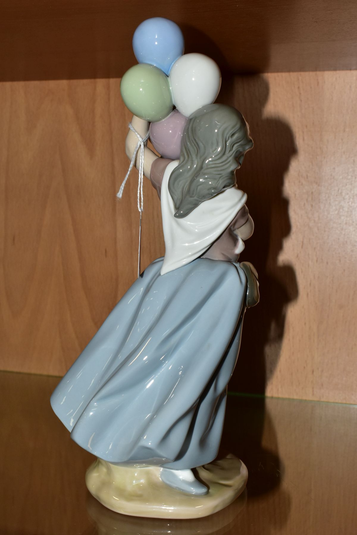 A LLADRO FIGURE 5141 'Balloon Seller', designed by Vincente Martinez, issued 1982-1996, height - Image 4 of 6