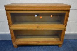 A GLOBE WERNICKE LIGHT OAK TWO SECTIONAL BOOKCASE, with glazed fall front doors, width 85cm x