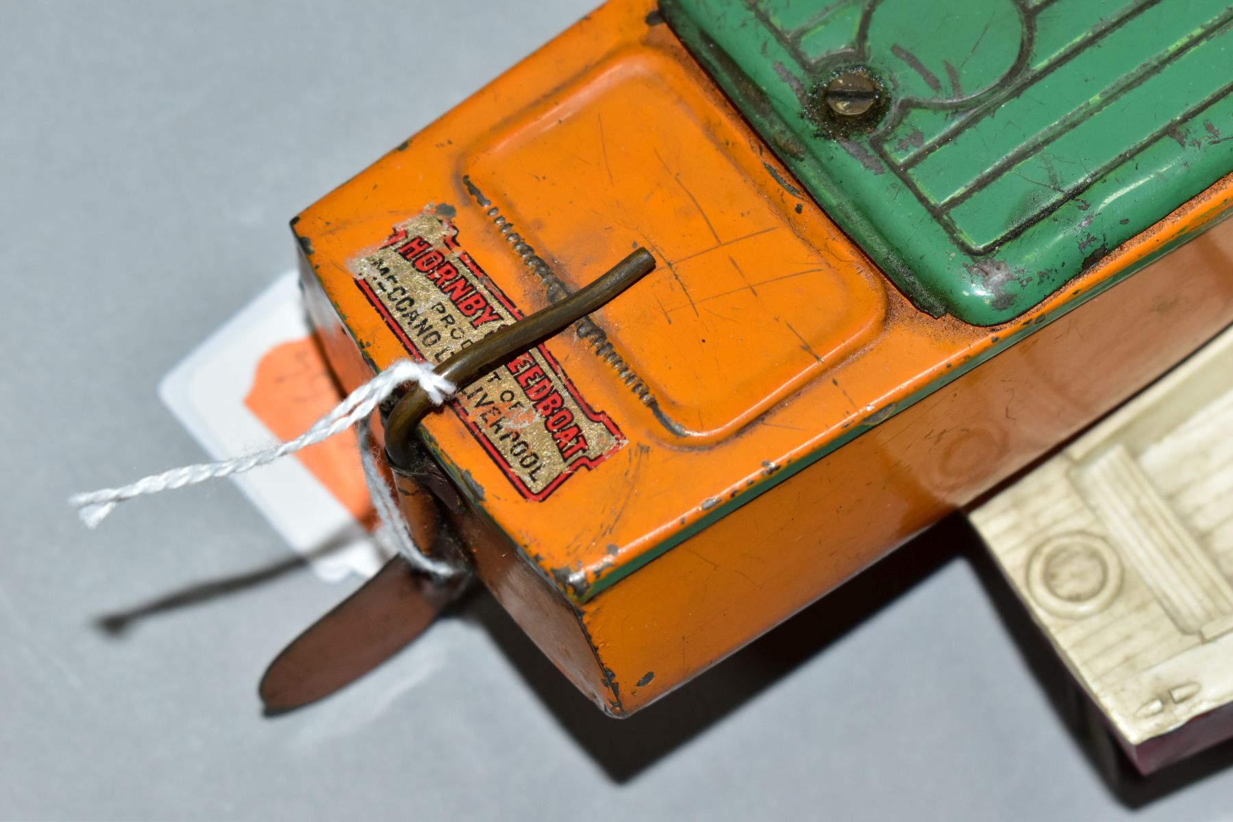 AN UNBOXED HORNBY TINPLATE CLOCKWORK SPEEDBOAT, 'Martin', missing key, orange with green hatch - Image 4 of 6