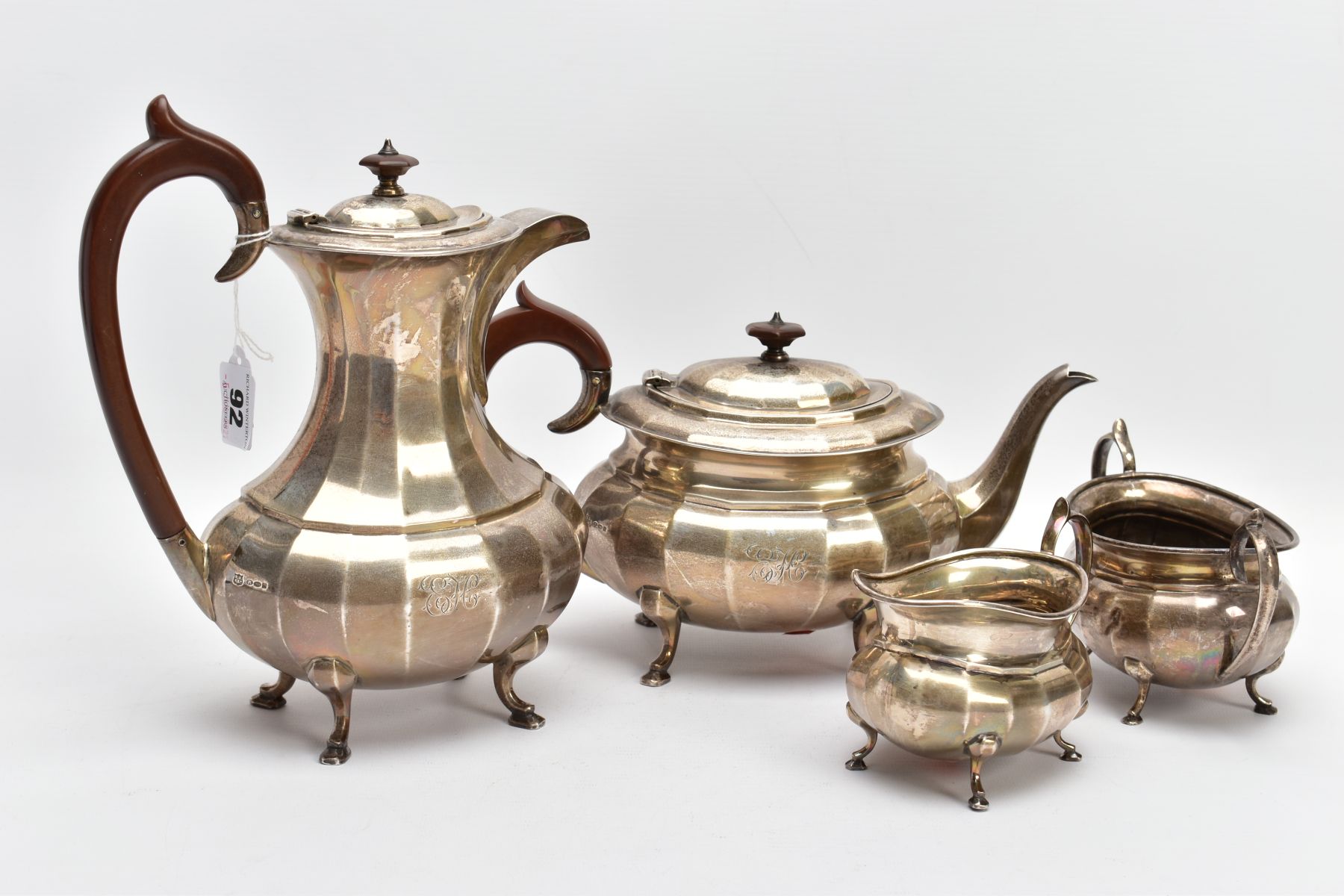 A FOUR PIECE GEORGE.V SILVER TEA SET, to include a teapot and hot water jug each of a faceted George - Image 2 of 8