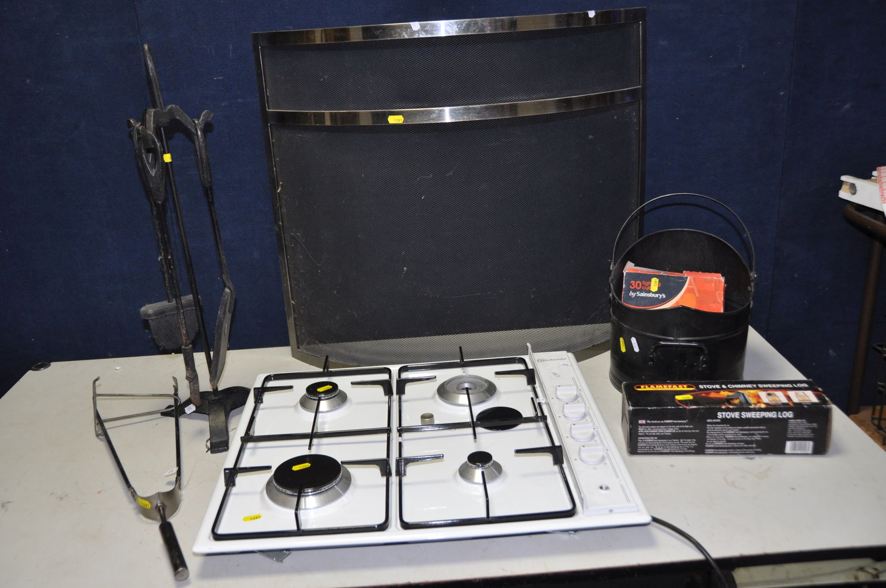 A BAUKNECHT GAS HOB (missing one gas ring and ignition knob doesn't fit) a curved Fire Guard, a
