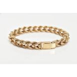A HEAVY 9CT GOLD ROPE TWIST BRACELET, intertwined rope twist design with applied bead detail, fitted