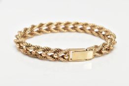 A HEAVY 9CT GOLD ROPE TWIST BRACELET, intertwined rope twist design with applied bead detail, fitted