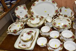 A ROYAL ALBERT OLD COUNTRY ROSES DINNER SERVICE, firsts and seconds, two twin handled tureens and