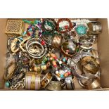 A BOX OF COSTUME JEWELLERY, to include a quantity of fashion bangles and bracelets, beaded