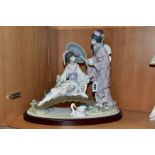 A LLADRO FIGURE GROUP, 'Springtime in Japan' (two Japanese Geisha on a bridge), No 1445, issued 1983