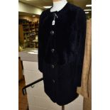 A LADIES TORY BURCH DARK NAVY LAMBSKIN THIGH LENGTH COAT, with pockets and five gilt detail buttons,