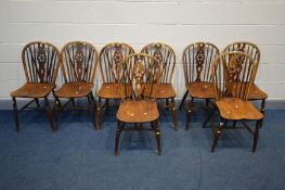 A HARLEQUIN SET OF EIGHT GEORIGAN ELM/OAK HOOP BACK CHAIRS, to include three with a star cut out