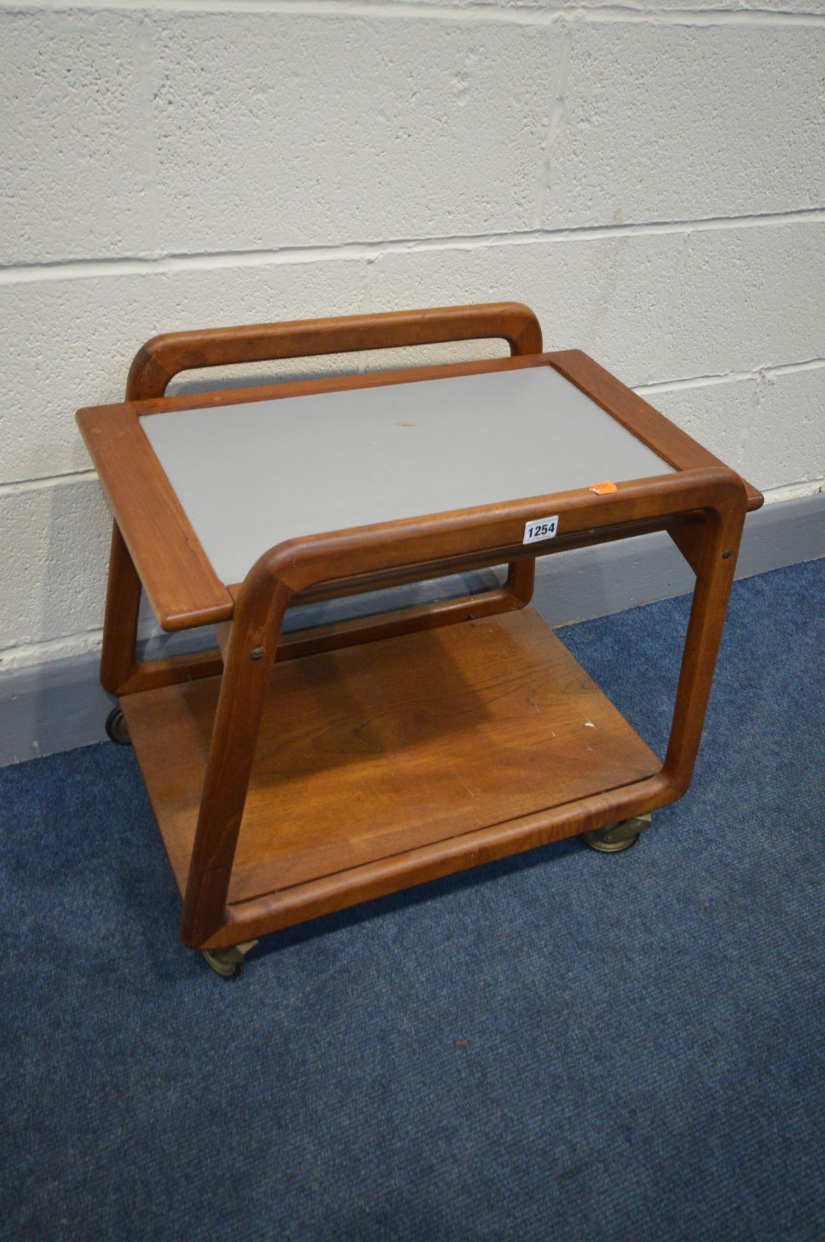 A SIKA MOBLER DANISH TEAK DRINKS TROLLEY, with a reversable tray, on casters, width 62cm x depth - Image 2 of 2