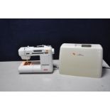 AN ELNA 6004 COMPUTER SEWING MACHINE with plastic cover and power lead (no footswitch) (PAT pass and