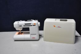 AN ELNA 6004 COMPUTER SEWING MACHINE with plastic cover and power lead (no footswitch) (PAT pass and