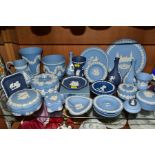 A COLLECTION OF WEDGWOOD JASPERWARE IN PALE BLUE AND PORTLAND BLUE, including bud vases, six trinket