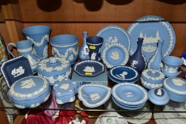 A COLLECTION OF WEDGWOOD JASPERWARE IN PALE BLUE AND PORTLAND BLUE, including bud vases, six trinket