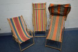 THREE VINTAGE DECK CHAIRS, one with a hood