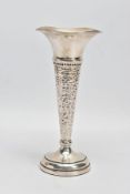 A SILVER STEM VASE, of conical form with hammered detail, flared undulating rim and a weighted base,