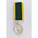 A GEORGE VI TERRITORIAL EFFICIENCY MEDAL, the oval medal suspended from a green and yellow ribbon,