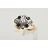 AN 18CT GOLD DIAMOND AND SAPPHIRE CLUSTER RING, the central brilliant cut diamond within a collet