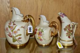 THREE ROYAL WORCESTER IVORY GROUND JUGS/EWER, comprising a tusk ewer, shape no 1116, date cypher for