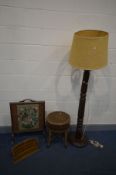 A VICTORIAN MAHOGANY FLUTED STANDARD LAMP, with a rattan shade, converted from a bed post (repair to