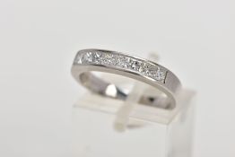 A PLATINUM DIAMOND HALF ETERNITY RING, designed with channel set princess cut diamonds, total