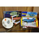 A BOXED DINKY TOYS THUNDERBIRD 2, NO 106, metallic blue body, black plastic base and yellow legs,