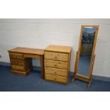 A QUANTITY OF PINE BEDROOM FURNITURE to include a desk with three drawers, chest of four deep