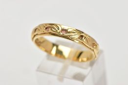 AN 18CT GOLD CLOGAU BAND RING, with applied 'Tree of Life' design around the ring, inner ring