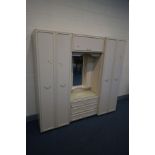 A FRENCH STYLE THREE PIECE BEDROOM FITMENT, overall width 194cm x depth 50cm x height 187cm