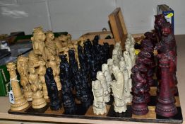 A WOODEN CHESS BOARD AND A QUANTITY OF WOODEN AND RESIN CHESS SETS, including two resin sets