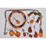 A SELECTION OF MAINLY CLARIFIED AMBER JEWELLERY, including an elasticated panel bracelet, a pair