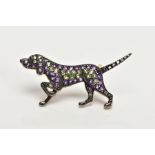 A GEM SET DOG BROOCH, designed as a pointer dog, set with circular peridots and amethysts to the