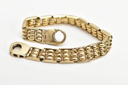 A 9CT GOLD BRACELET, the articulated bracelet designed with triple banded links, fitted with a