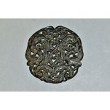 A CHINESE CARVED AND PIERCED CIRCULAR HARDSTONE TABLET, with serpents and scrolls, diameter 6.7cm