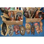 TWO BOXES OF 20TH CENTURY CARVED AFRICAN FACE MASKS AND WALL HANGINGS, etc, a variety of different