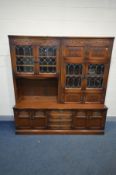 AN OLD CHARM OAK WALL UNIT, width 183cm x depth 43cm x height 189cm (splits into three sections)