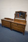 A TWO PIECE OAK BEDROOM SUITE, comprising a dressing chest with a single swing mirror and four