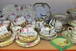 FOUR TEA/DINNER SETS, comprising Royal Worcester pink trim decorated part tea service (milk, jug,