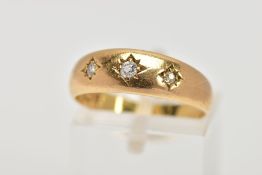 AN 18CT GOLD THREE STONE DIAMOND RING, designed with three, star set old cut diamonds, total