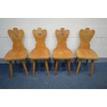 A SET OF FOUR PINE MID TO LATE 20TH CENTURY CHAIRS, pierced heart to the shaped backs, on