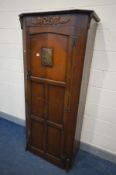 AN OAK PANELLED SINGLE DOOR HALL ROBE, with a later brass panel, width 82cm x depth 44cm x height