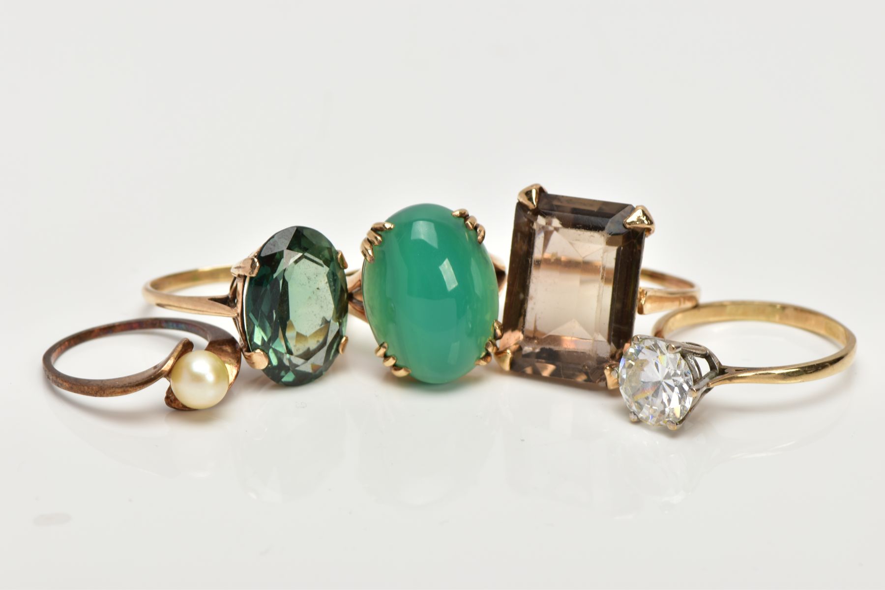FIVE MODERN DRESS RINGS, all hallmarked or stamped '9ct', to include a large Citrine, a dyed green