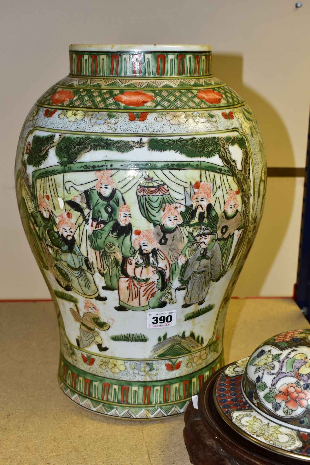 A CHINESE PORCELAIN FAMILLE VERT JAR AND COVER, decorated with figures flowers and insects, jar