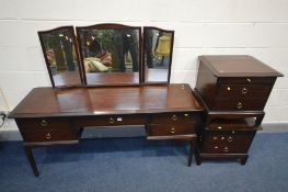 A STAG MINSTREL FOUR PIECE BEDROOM SUITE comprising a dressing table, with a triple mirror, width