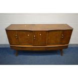 A BEAUTILITY WALNUT SIDEBOARD, with central pull out drinks section flanked by double cupboard