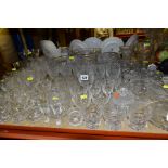 A GROUP OF GLASSWARE, including drinking glasses, bowls, bowls and covers, jugs and vases, a small